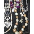 A VINTAGE COLLECTION DESIGNER COSTUME NECKLACES SOLD AS IS