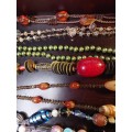 A VINTAGE COLLECTION OF HEAVY BEADED WITH SEMI-PRECIOUS STONES