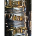 A BEAUTIFUL SET OF 16 STAINLESS STEEL NAPKIN RINGS WITH GOLD PLATED BOWS
