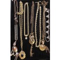 A COLLECTION OF VINTAGE GOLD PLATED NECKLACES SOLD AS IS
