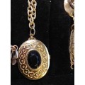 A COLLECTION OF VINTAGE GOLD PLATED NECKLACES SOLD AS IS
