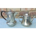 TWO ANTIQUE SILVER PLATED JUGS SOLD AS IS