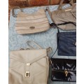 A BULK JOBLOT WOMAN`S HANDBAGS SOLD AS IS