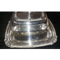 A VINTAGE EPNS BUTTER DISH SOLD AS IS