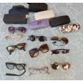 A COLLECTION OF VINTAGE SPECTACLES AND CASES