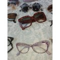 A COLLECTION OF VINTAGE SPECTACLES AND CASES
