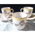 A COLLECTION OF HAND PAINTED TEA CUPS AND SAUCERS
