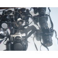 ASSORTED LOT OF WORKING CAMERA BODIES WITH AND WITH OUT LENSES.