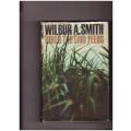 WHEN THE LION FEEDS BY WILBUR SMITH