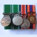 Grouping Of Four Full Size Medals - The 20 Year Medal Has A Silver Marking.