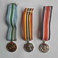 A Group Of Three SADF Miniature Medals With Ribbons