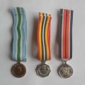 A Group Of Three SADF Miniature Medals With Ribbons