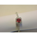 Sterling Silver Ruby & Zirconia (red stone) ring.