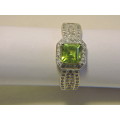 Sterling Silver, Peridot & Zirconia (green stone) ring.