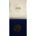 1988 Protea R1 : Les Hugenote 1 Rand Coin in blue SAM box