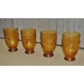 Vintage mid-century embossed amber glass decanter with four glasses