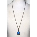 Vintage antique brass tone chain necklace with large blue marble pendant