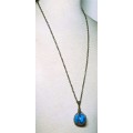 Vintage antique brass tone chain necklace with large blue marble pendant