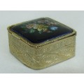 Small square gold tone pill box with cobalt blue floral bouquet ceramic decoration