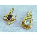 Pair of vintage gold tone 1970s style pendants with faceted crystal