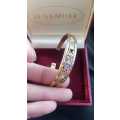 9ct yellow gold bangle with precious stones in box