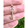 Striking Rose gold key 9ct pendant