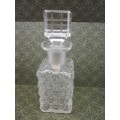 Glass perfume bottle with stopper. Small chip on the rim