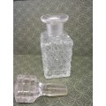 Glass perfume bottle with stopper. Small chip on the rim