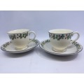 Two pretty unmarked cups and saucers - note chips