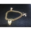 9ct gold bracelet with charms 37g and gold heart lock clasp