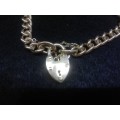 9ct gold bracelet with charms 37g and gold heart lock clasp