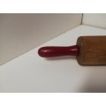 Cake roller with red handles