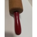 Cake roller with red handles