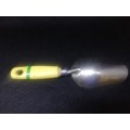Scoop with yellow/green handle