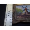Cast metal frame and painting