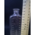 Table spoon measured medicine bottle
