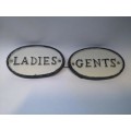 Cast iron ladies/gents signs