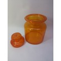 Small Bright orange glass bottle and glass lid