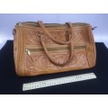 Hand crafted leather handbag with shoulder strap