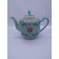 Turquoise Chinese tea pot - note chip on lid