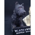 Old and damaged Black & Shite Scotch Whisky Scotty dogs