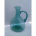 Turquoise blue glass bottle - it has a crack just above the handle - but beautiful!