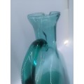 Turquoise blue glass bottle - it has a crack just above the handle - but beautiful!