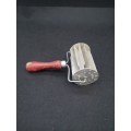Koeksister cutter with wooden handle