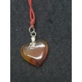 Semi-precious stone heart pendant on a string