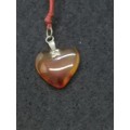 Semi-precious stone heart pendant on a string