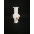 White glass vase with flower