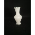 White glass vase with flower
