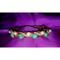 A gorgeous florenza rolled gold and colourful stone and pearl bracelet