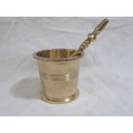 Brass pestle and mortar.
